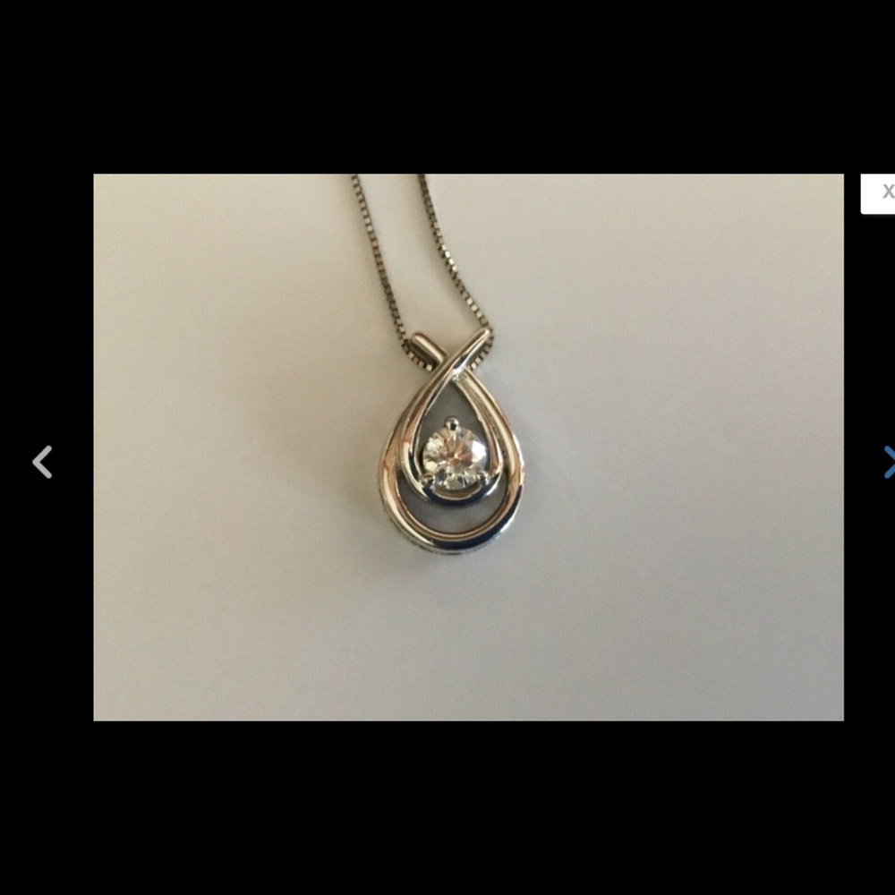 14K white gold, 3/4 carat diamond pendant.